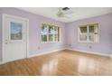 Simple bedroom with light walls and wood floors at 1620 Morin St, Eustis, FL 32726