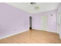 Spacious bedroom with light purple walls at 1620 Morin St, Eustis, FL 32726