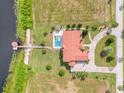 Bird's eye view of home, pool, dock and lakefront property at 7616 Lily Ct, Groveland, FL 34736