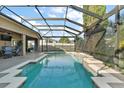 Large screened pool and spa at 114 Compass Rose Dr, Groveland, FL 34736