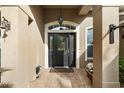 Inviting front entrance with a decorative door and tiled flooring at 114 Compass Rose Dr, Groveland, FL 34736