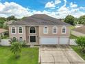 Two-story house with a two-car garage and spacious driveway at 1340 Banbridge Dr, Kissimmee, FL 34758