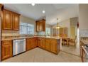 Updated kitchen with wood cabinets and granite countertops at 3921 Doune Way, Clermont, FL 34711