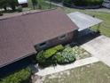 Aerial view of home showing roofline, carport and landscaping at 1658 Clay Blvd, Eustis, FL 32726