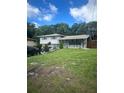 Ranch style home with landscaped front yard at 2524 Good Homes Rd, Orlando, FL 32818