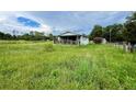 Ranch home surrounded by a large grassy yard at 708 Lake Shore Dr, Pierson, FL 32180