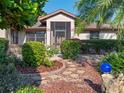 Landscaped entrance to single Gathering home at 21821 Prince William Ct, Leesburg, FL 34748