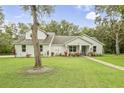 Single story home with landscaped yard at 1136 Brick Rd, Winter Garden, FL 34787