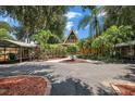 A-frame home with covered parking and landscaped yard at 507 Lakeshore Dr, Eustis, FL 32726