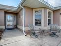 Inviting front patio with seating area, perfect for relaxing at 616 Cokesbury Dr, The Villages, FL 32162