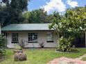 Charming one-story home with a green metal roof at 951 Cr 482B, Lake Panasoffkee, FL 33538