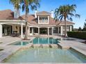 Luxury pool and spa with spacious patio and outdoor seating at 15008 Pendio Dr, Bella Collina, FL 34756