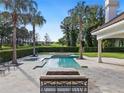 Resort-style pool with spa, fire pit, and expansive patio at 15008 Pendio Dr, Bella Collina, FL 34756