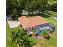 House with pool and lush landscaping at 5515 Citation Ct, Lady Lake, FL 32159