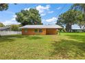 Single story home with a metal roof and spacious yard at 10367 Se Sunset Harbor Rd, Summerfield, FL 34491