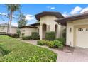 Landscaped front yard with a brick walkway to the house entrance at 39644 Harbor Hills Blvd, Lady Lake, FL 32159