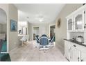 Charming dining area with a glass table and four chairs at 9823 Se 178Th Ln, Summerfield, FL 34491