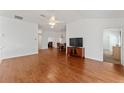 Hardwood floor living room with access to kitchen and bedrooms at 1683 Moncks Cor, The Villages, FL 32162