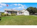 House exterior showcasing a well-maintained lawn and landscaping at 6401 Tildon, Leesburg, FL 34748