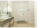 Bright and airy entryway with a console table and mirror at 2019 Majorca Dr, Kissimmee, FL 34747
