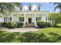 Front view of a charming farmhouse style home at 26012 Splendid Meadow Ct, Astatula, FL 34705