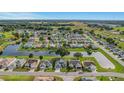 Aerial view of a large community of single-Gathering homes at 120 Trailwood Dr, Leesburg, FL 34748