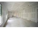 Unfinished interior room showing open floor plan and ample natural light at 10593 Grand Oaks Blvd, Oxford, FL 34484