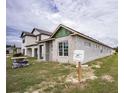 Unfinished block home exterior with a gray color scheme at 10593 Grand Oaks Blvd, Oxford, FL 34484