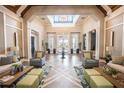 Spacious clubhouse lobby with high ceilings, comfortable seating, and elegant decor at 10607 Grand Oaks Blvd, Oxford, FL 34484
