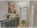 Bright entryway with a console table and large artwork at 1592 Flange Dr, Davenport, FL 33896