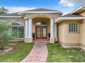 Elegant entrance with double doors and brick pathway at 275 Cr 552, Bushnell, FL 33513