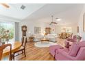 Spacious living room with hardwood floors and ample seating at 501 Herrera Ct, The Villages, FL 32159