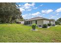 Large backyard with lush green grass at 6419 Borg St, Leesburg, FL 34748