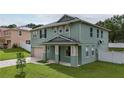 Two story house with a green exterior and a gray roof at 1563 Pier St, Clermont, FL 34711