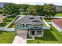 Two story house with a green exterior and a gray roof at 1563 Pier St, Clermont, FL 34711