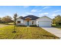 New construction home with craftsman style and landscaping at 577 Dowling Cir, Lady Lake, FL 32159