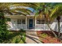 Inviting front porch with rocking chairs, enhancing curb appeal at 2630 Mcdonald Ter, Mount Dora, FL 32757