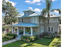 Two-story home with a wrap around porch at 101 S Dixie Ave, Fruitland Park, FL 34731