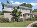 Two-story home with side yard and landscaping at 101 S Dixie Ave, Fruitland Park, FL 34731