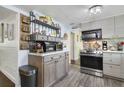 Modern kitchen with an island and stainless steel appliances at 151 S Clayton St, Mount Dora, FL 32757