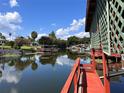 Peaceful canal view with lush greenery and private dock access at 34323 Island Dr, Leesburg, FL 34788