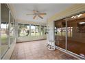 Bright Florida room with tiled flooring and sliding glass doors at 1401 Valparaiso St, The Villages, FL 32162