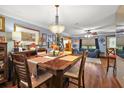 Bright dining room with hardwood floors and a view into the living room at 205 Josephine Ave, Fruitland Park, FL 34731