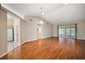 Spacious living room with hardwood floors and sliding doors at 4907 Tara View Rd, Leesburg, FL 34748