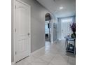 Bright entryway with tile flooring and access to other rooms at 10548 Bronze Leaf Ct, Leesburg, FL 34788