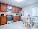 Modern kitchen with stainless steel appliances and breakfast nook at 16 Escondido Cir # 216, Altamonte Springs, FL 32701