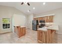 Open kitchen with granite countertops and wood cabinets at 8222 Florida Boys Ranch Rd, Groveland, FL 34736