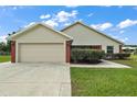 Charming one-story home with attached garage and manicured lawn at 8222 Florida Boys Ranch Rd, Groveland, FL 34736