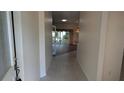 Welcoming foyer with tile flooring and a view into the living area at 17755 Se 85Th Ellerbe Ave, The Villages, FL 32162