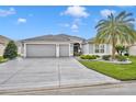 Two-car garage and nicely landscaped front yard at 3024 Hicks Pl, The Villages, FL 32163